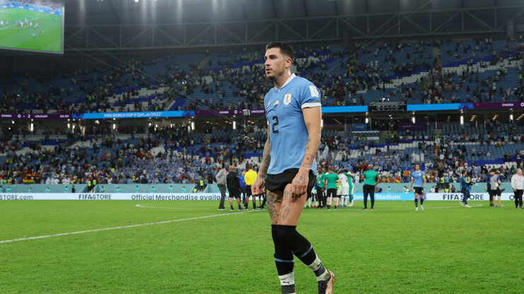 A PHOTO.  Emotions took over.  Uruguayan player punches FIFA director