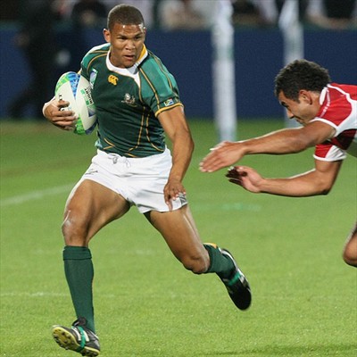 В атаке игрок сборной ЮАР Рино Бенджамин